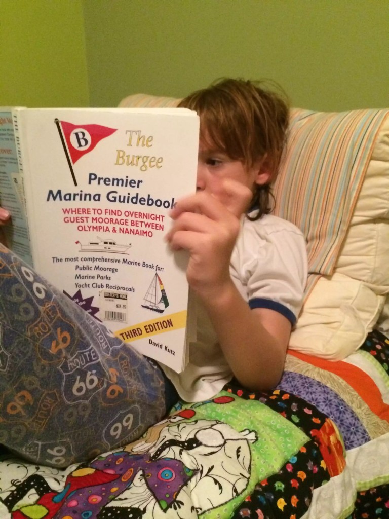 Carson reading up on marinas in preparation for our new life.