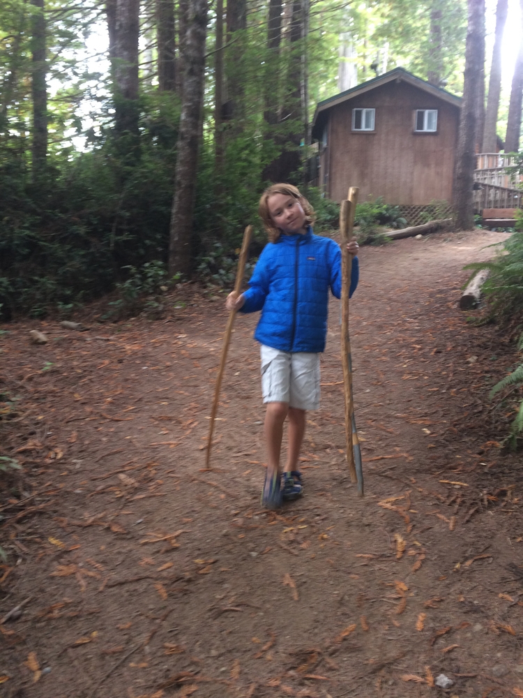Carson, collecting walking sticks for our hike down